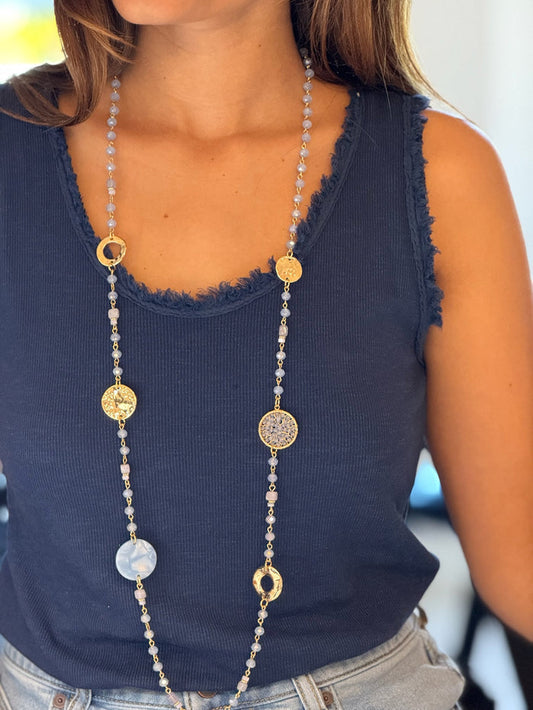 long blue beaded necklace with intricate details