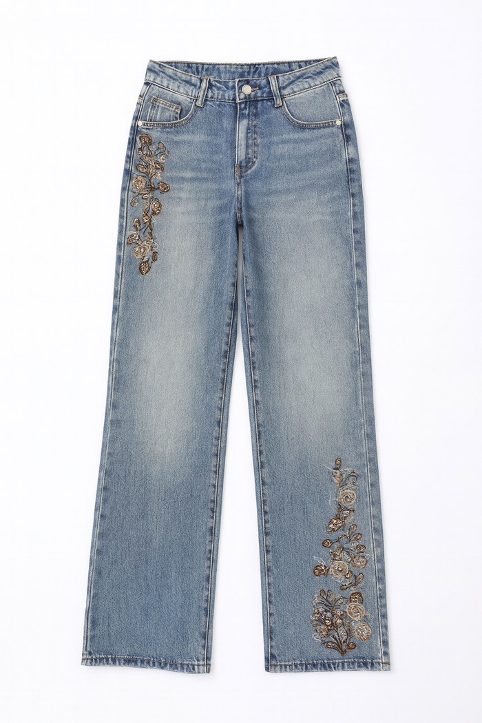 Blue straight-leg jeans with floral embroidery on the hip and lower leg.