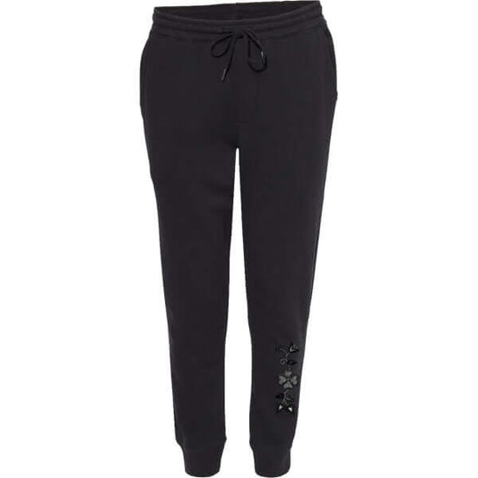 Black joggers with flower embellishments, offering stylish comfort for everyday wear.