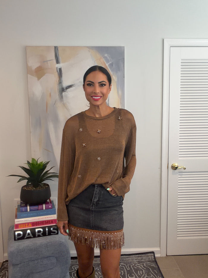 Bronze metallic long sleeve pullover sweater top with a crew neckline and floral embroidered embellishments on the front.