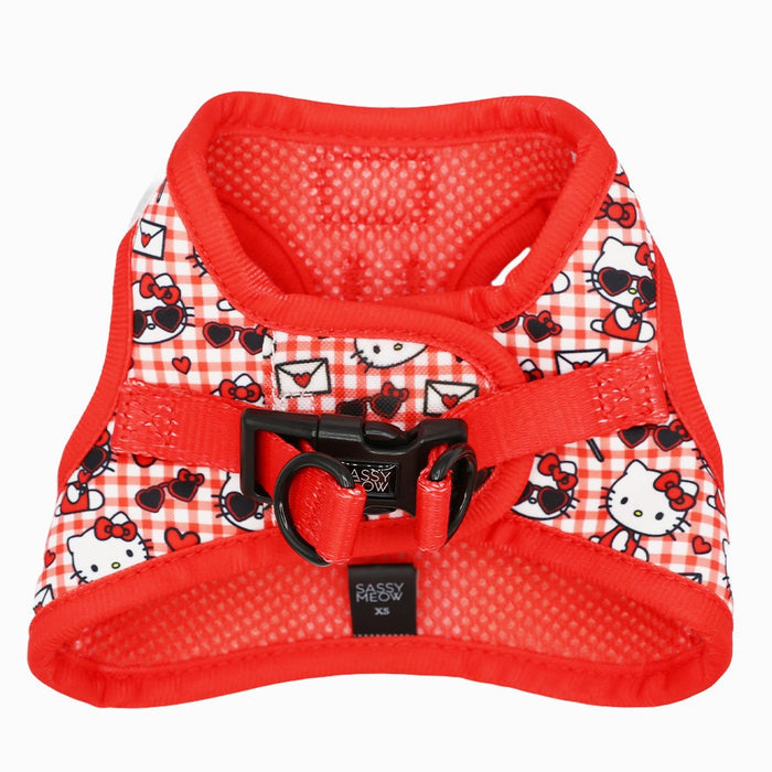 A red and white plaid Cat Step-In Harness - Hello Kitty® Red Classic by Sassy Woof with custom printed neoprene, Hello Kitty faces, red trim, black buckle and ring, and a Sassy Woof XS label.