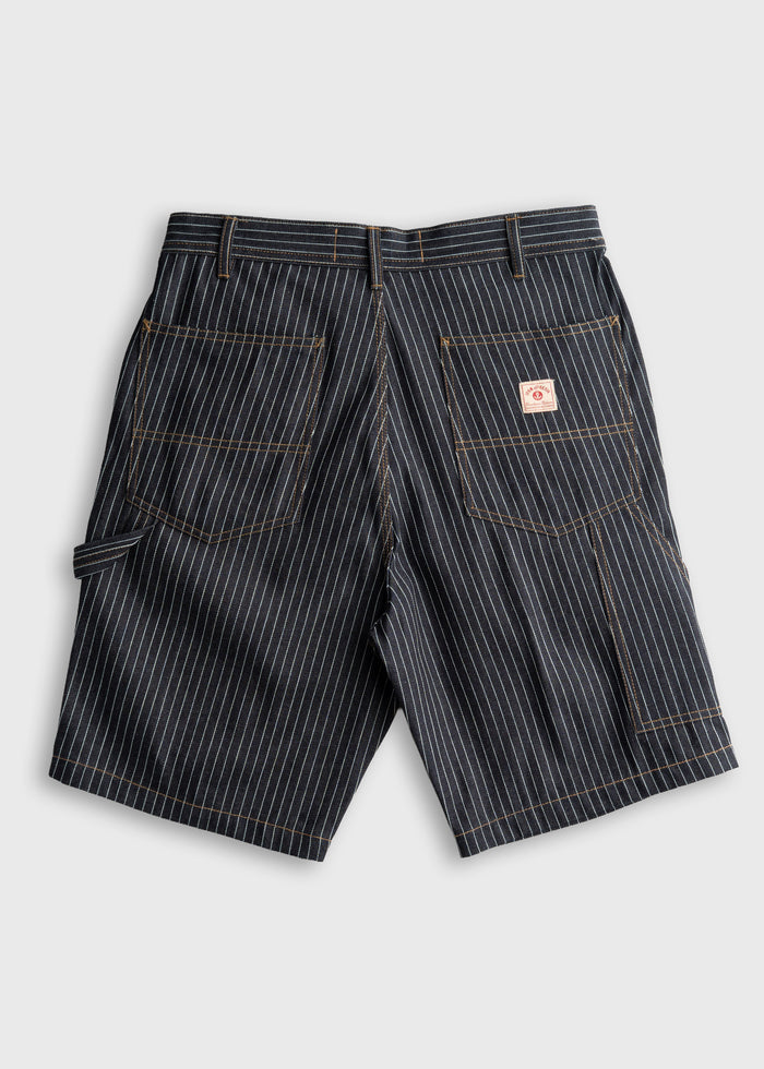 Pinstriped work shorts with back pockets and a small logo patch, displayed on a plain background, highlighting their design.