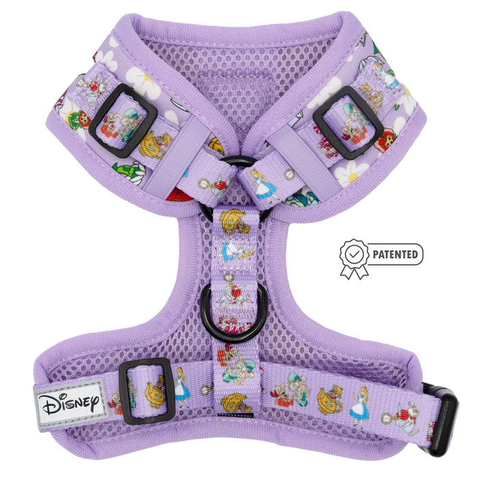 The Sassy Woof Dog Adjustable Harness - Alice in Wonderland (Purple) features mesh material, Disney princesses on the straps, a black D-ring for leashes, a patented symbol, and a sewn Disney logo tag for charming style.