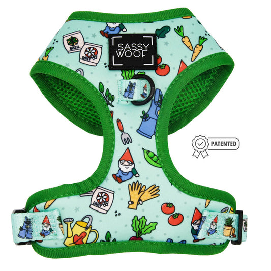 The Sassy Woof Dog Adjustable Harness - Chillin with my Gnomies features a mint green, no-pull design with green trim, garden gnome and veggie illustrations, the Sassy Woof label, and a small patented badge icon.