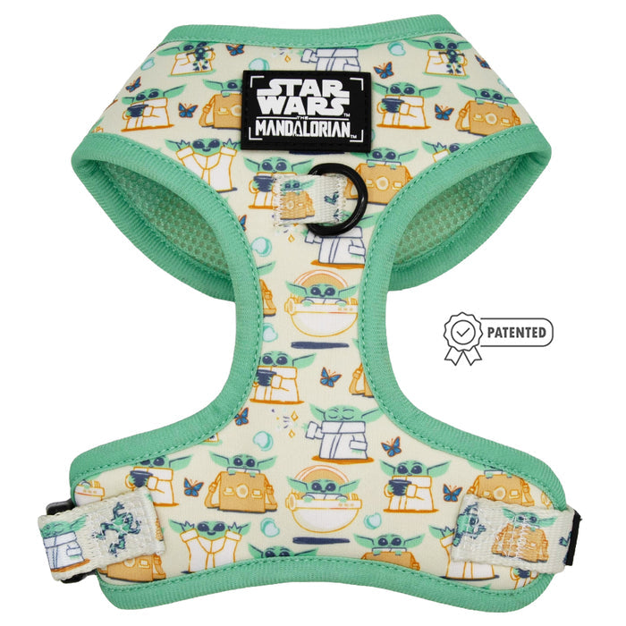 The Sassy Woof Dog Adjustable Harness - STAR WARS™ The Child™ is a mint green, no-pull harness with Grogu (Baby Yoda) and droid cartoons, plus a black Mandalorian patch on the front.
