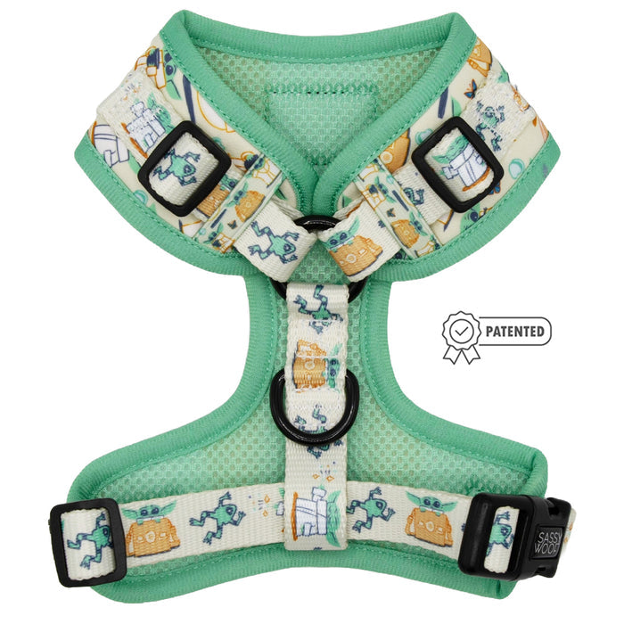 The Sassy Woof Dog Adjustable Harness - STAR WARS™ The Child™ features playful green and cream designs with dogs, medical tools, pet carriers, black buckles, and a Patented badge next to this custom-printed harness.