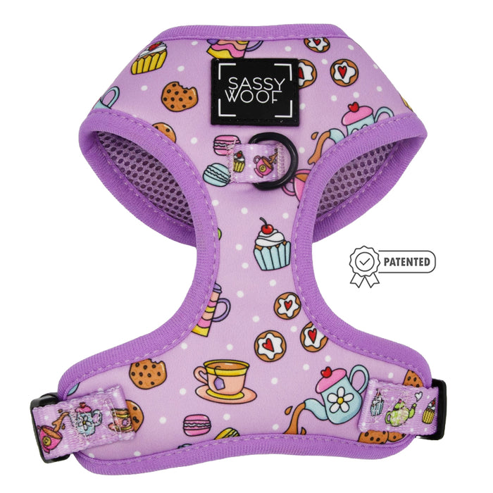 The Sassy Woof Dog Adjustable Harness - Tea Pawty features a purple design with teapots, teacups, cupcakes, and cookies; includes logo on front and Patented badge; adjustable for comfort and puppy growth.