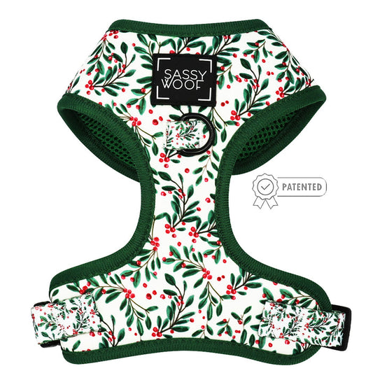 The Sassy Woof Dog Adjustable Harness - Under the Mistletoe is a small, green and white harness for dogs.