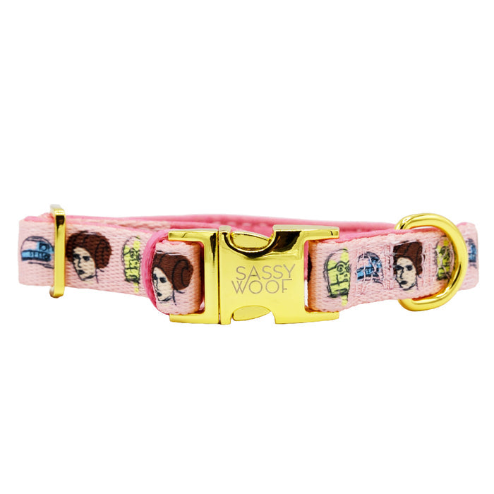The Sassy Woof Dog Collar - STAR WARS™ Princess Leia features a pink design with a gold buckle, perfect for fans who want their pup to show off Leia-inspired style.