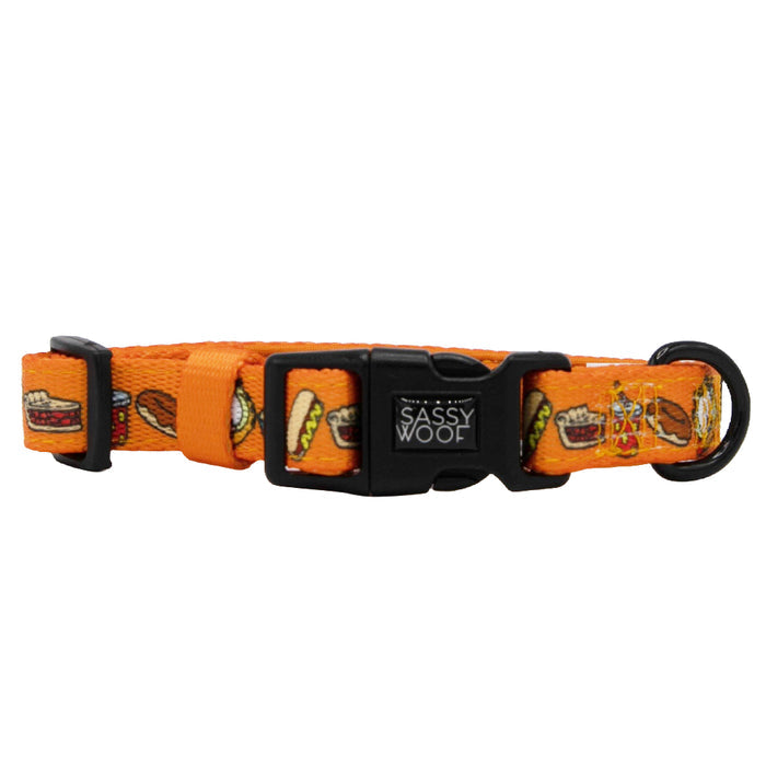 The Sassy Woof Dog Collar Three Piece Bundle - Garfield™ features an orange collar adorned with hot dogs, burgers, and BBQ food illustrations, complete with a black plastic buckle and adjustment clip—an ideal playful accessory for fans of Garfield pet products looking to add character to their pup’s style.