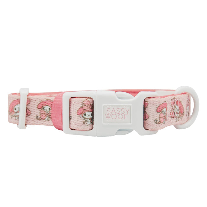 A pink dog collar from the Sassy Woof Dog Collar Three Piece Bundle - My Melody™, adorned with small cartoon mushrooms and characters, featuring a white buckle printed with "Sassy Woof.