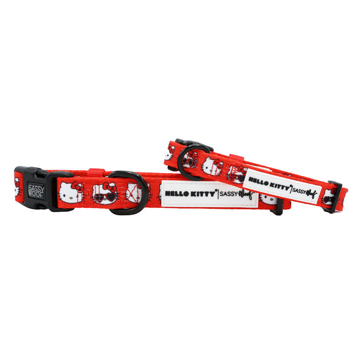 The Sassy Woof Dog Four Piece Bundle - Hello Kitty® Red Classic features red pet collars with white panels, Hello Kitty Valentine designs, black “HELLO KITTY” text with a bow, adjustable black buckles, and metal rings.
