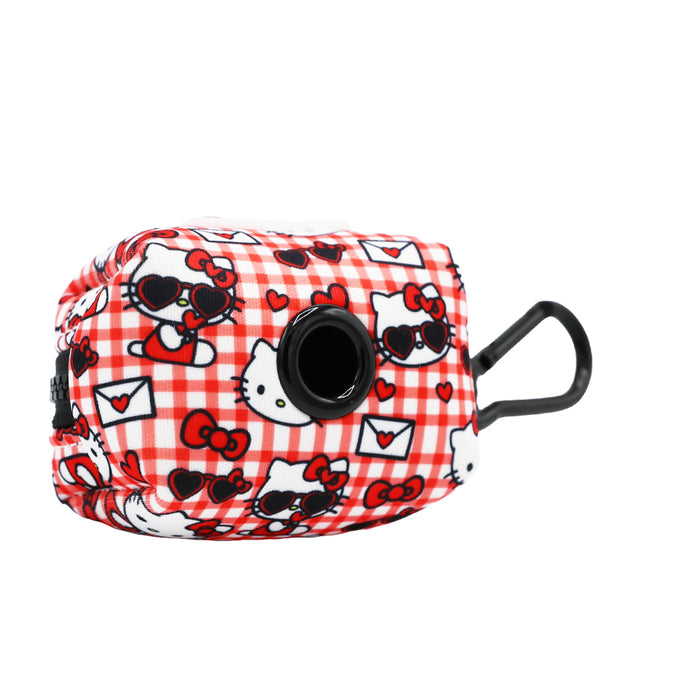 The Sassy Woof Dog Four Piece Bundle - Hello Kitty® Red Classic features a small red and white checkered bag with hearts, bows, Hello Kitty Valentine faces wearing sunglasses, plus a black circular dispenser and clip.