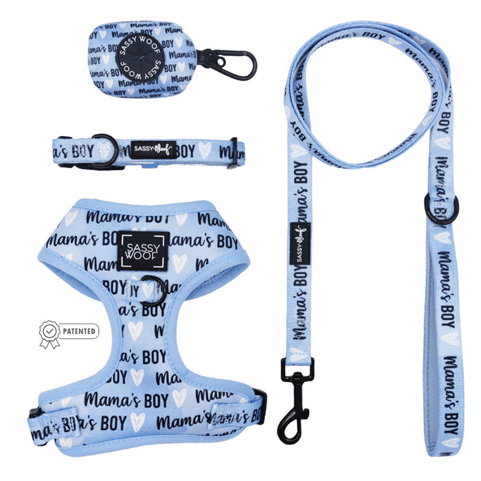 The Sassy Woof Dog Four Piece Bundle - Mama's Boy features a light blue adjustable collar, leash, harness, and waste bag holder with "Mama's Boy" text and white hearts.