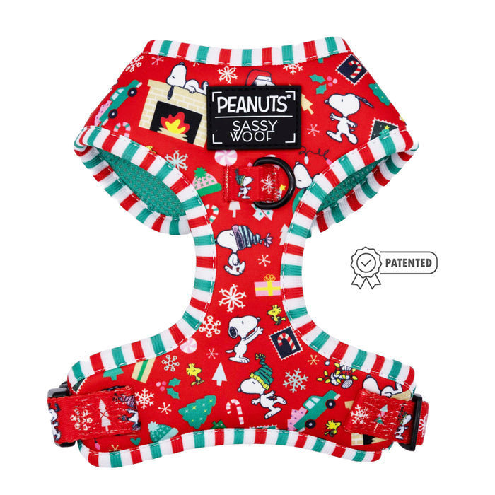 The Sassy Woof Dog Four Piece Bundle - Peanuts™ Beagle Bells features a red Snoopy harness with green and white striped trim, festive holiday Peanuts illustrations, and a patented badge for this cheerful dog accessory.