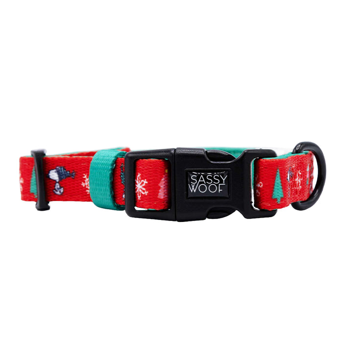 The Sassy Woof Dog Four Piece Bundle - Peanuts™ Beagle Bells features festive holiday designs, a black plastic Sassy Woof buckle, and a sturdy black D-ring—perfect for pairing with your dog's favorite holiday accessories.