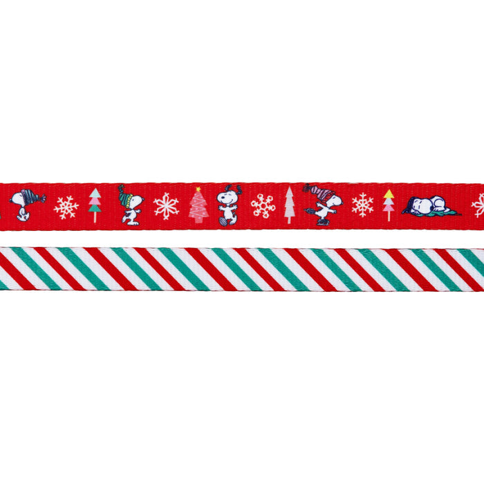 From Sassy Woof’s Dog Four Piece Bundle – Peanuts™ Beagle Bells: one ribbon shows Snoopy and Woodstock with snowflakes and Christmas trees on red; the other features festive diagonal stripes in red, white, and green.