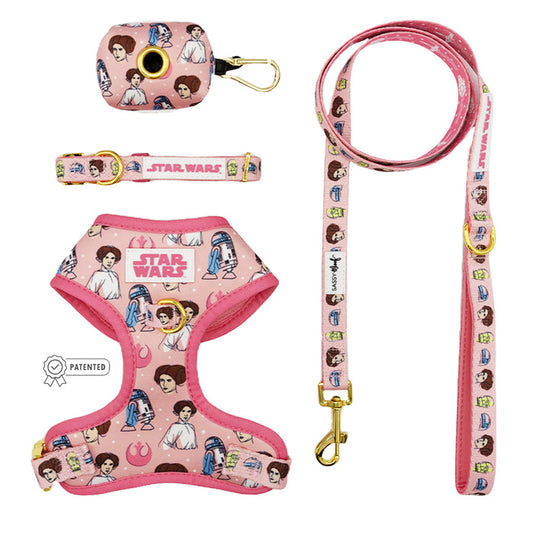 The Sassy Woof Dog Four Piece Bundle - STAR WARS™ Princess Leia includes an adjustable harness, leash, collar, and waste bag holder with cartoon Princess Leia, R2-D2, C-3PO, and Star Wars logo designs.