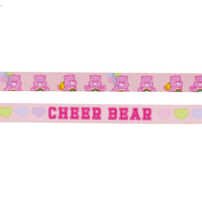 Sassy Woof’s Dog Leash - Care Bears™ Cheer Bear features pink ribbon with repeating Cheer Bear, rainbows, hearts, and balloons. CHEER BEAR is in bold pink letters with pastel hearts—perfect for a cute Care Bears dog harness look.