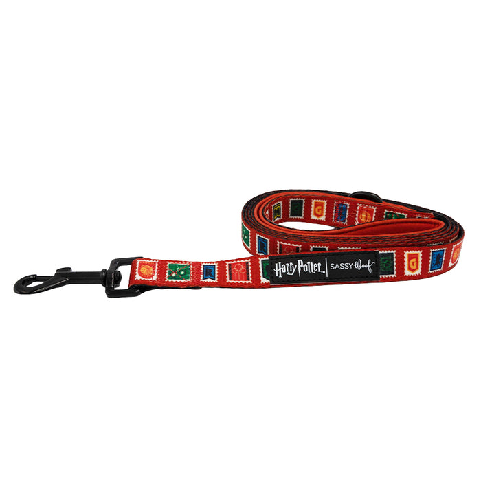 The Dog Leash - Harry Potter™ Stamps by Sassy Woof features a red design with colorful stamp-inspired patterns and a black metal clasp, finished with a Harry Potter | Sassy Woof label.