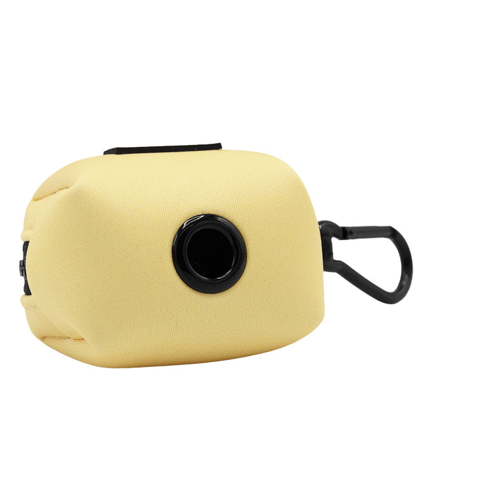 The Sassy Woof Dog Three Piece Bundle - Daffodil includes a soft yellow pouch with a black dispenser and clip, ideal for holding and dispensing dog waste bags while attached to your leash.