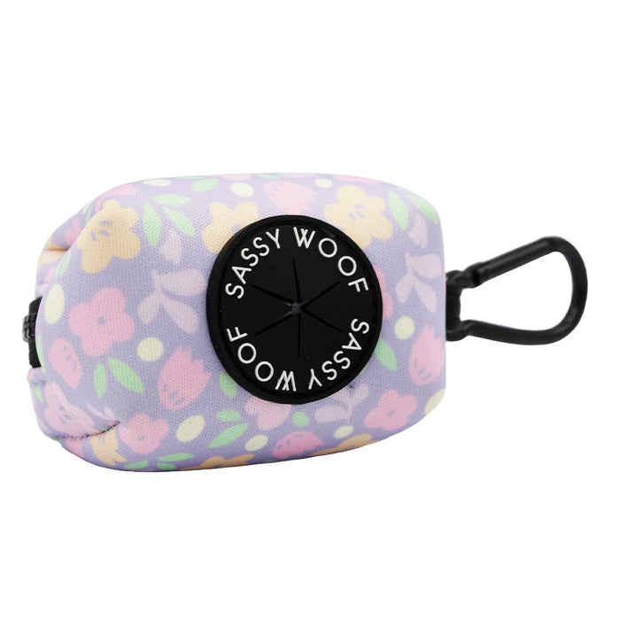 The Sassy Woof Dog Three Piece Bundle - Fleur de Sass includes a pastel floral waste bag holder with a black circular dispenser and clip, ideal for walks and essential for your puppy's growth pawtection plan.