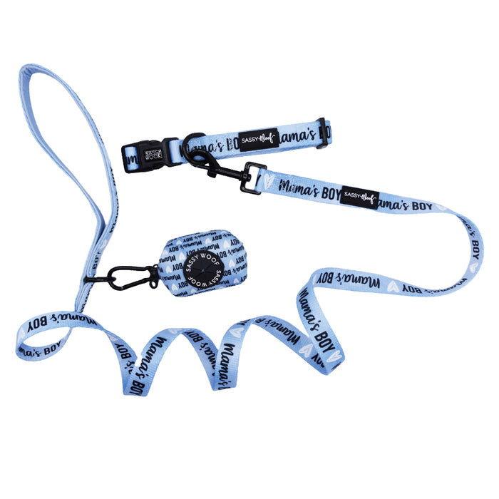 The Sassy Woof Dog Three Piece Bundle - Mama's Boy features a light blue collar, leash, and waste bag holder with “Mamas Boy” in black and small white hearts, shown on a white background.