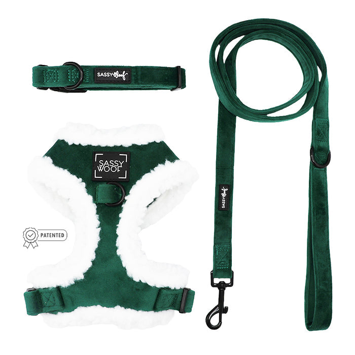 The Sassy Woof Dog Three Piece Bundle - Nice features a deep green sherpa harness and matching leash with white faux fur lining, adjustable straps, metal hardware, and the Sassy Woof label—perfect for the holidays.