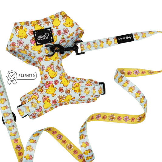 The Sassy Woof “Dog Two Piece Bundle - Good Duck, Babe!” features a playful yellow duck design. This adjustable harness and leash set adds fun style to walks while keeping your pup comfortable and safe.