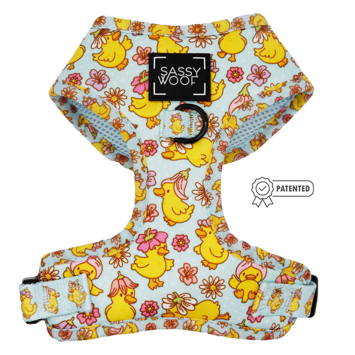 The Sassy Woof Dog Two Piece Bundle - Good Duck, Babe! features a playful blue harness with yellow ducks and pink flowers, an adjustable fit, and the patented Sassy Woof logo—ideal for pups on their puppy growth pawtection plan.