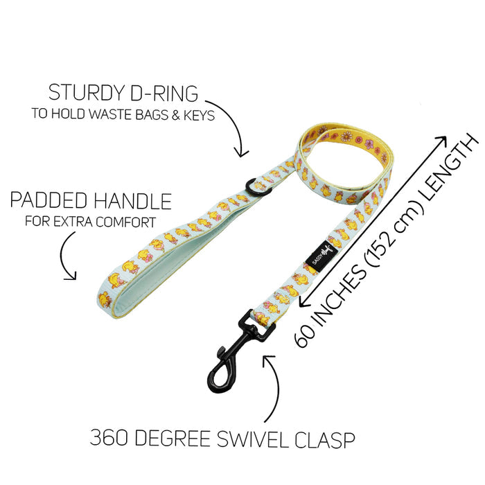 The Sassy Woof Dog Two Piece Bundle - Good Duck, Babe! includes a yellow cartoon dog leash and playful duck harness with sturdy D-ring, padded handle, 60-inch length, and 360-degree swivel clasp for comfort and convenience.