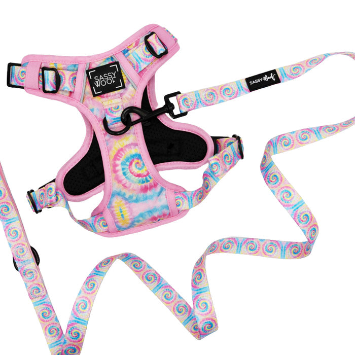 The Sassy Woof Dog Two Piece Bundle - Good Vibes is a step-in harness and matching leash, featuring multicolor tie-dye pastel swirls, black buckles, and a chest “Sassy Woof” label—ideal for pups with playful style.