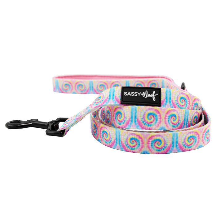The Sassy Woof Dog Two Piece Bundle - Good Vibes features a rainbow swirl leash with a black metal clasp and label on the handle—ideal for matching your favorite multicolor tie-dye dog harness. Shown on a white background.
