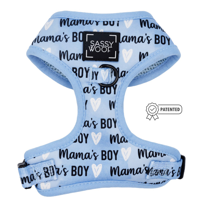 The Sassy Woof Dog Two Piece Bundle - Mama’s Boy features a light blue adjustable harness with "Mamas Boy" and white hearts, black trim, logo on the chest, patented symbol, and is ideal for your puppy growth pawtection plan.
