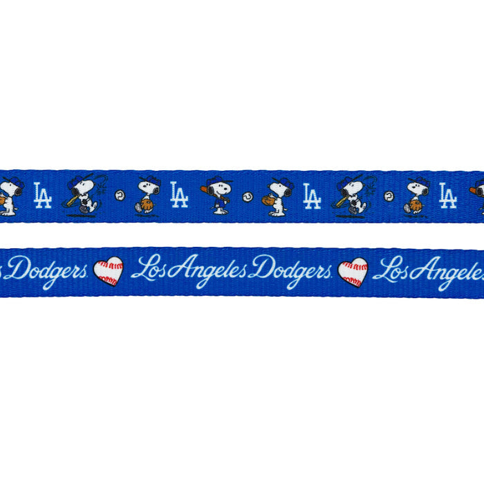 The Sassy Woof Dog Leash - MLB™ x Peanuts™ Los Angeles Dodgers™ features Snoopy playing baseball, the Dodgers LA logo and script, and red heart-shaped baseballs—perfect for stylish MLB dog accessories.