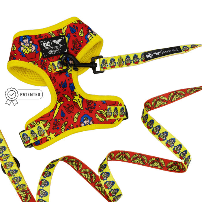 A Sassy Woof Dog Two Piece Bundle - Wonder Woman™ featuring a red and yellow harness with a matching adjustable leash.