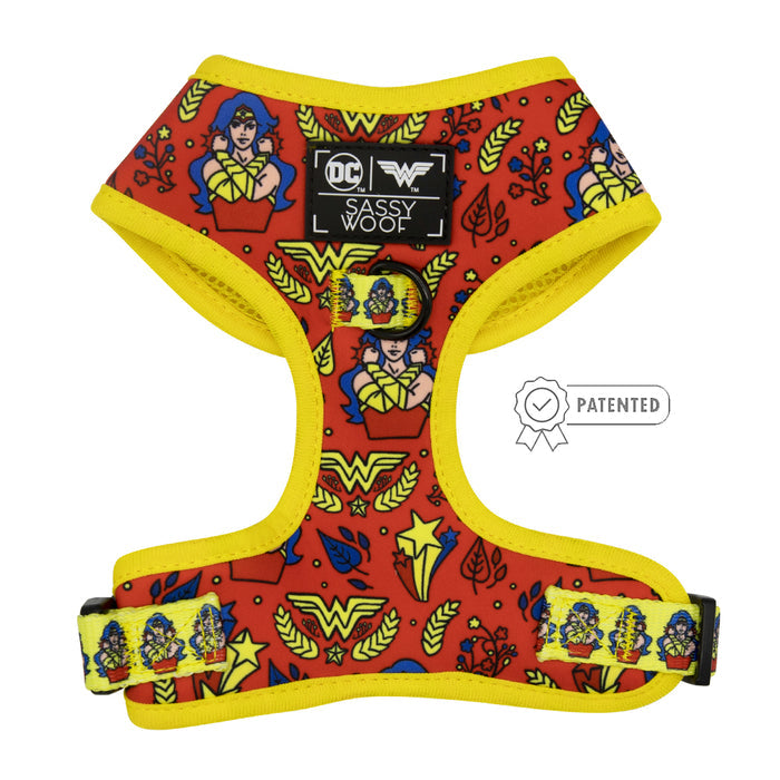 The Sassy Woof Dog Two Piece Bundle - Wonder Woman™ features a red and yellow harness with DC x Sassy Woof logos, yellow trim, adjustable strap, multiple Wonder Woman graphics, and a “PATENTED” badge for your heroic pet.