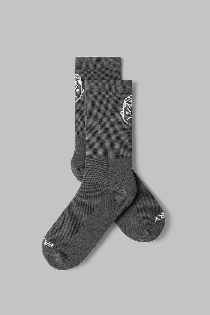 Pair of dark gray socks with a logo on a light gray background