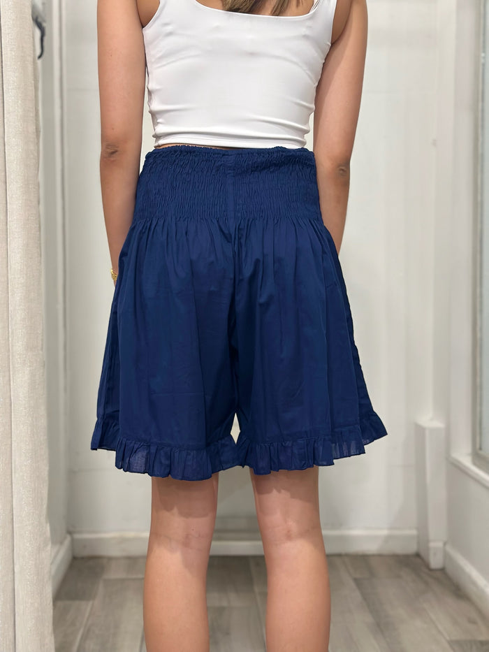 back view of woman wearing shorts