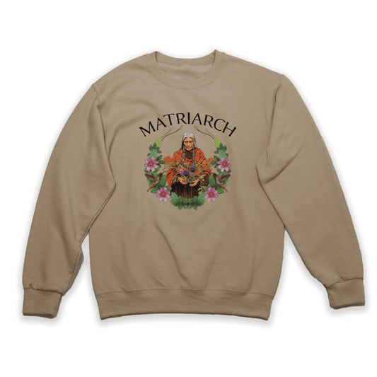 Matriarch Sweatshirt featuring an illustrated Indigenous matriarch surrounded by flowers, celebrating strength and wisdom.