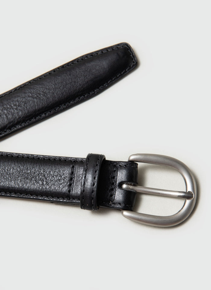 A close-up of the Percival Men's Leather Dress Belt in black, showing the textured leather and classic silver buckle.