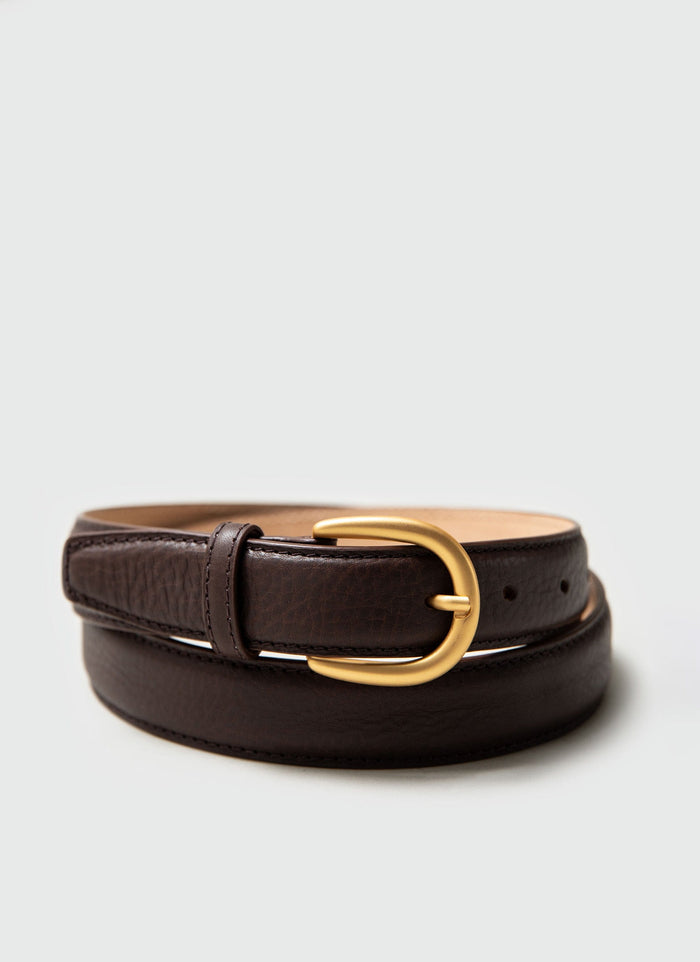 The Percival Men's Leather Dress Belt in brown, coiled up to display its classic gold buckle and textured leather.
