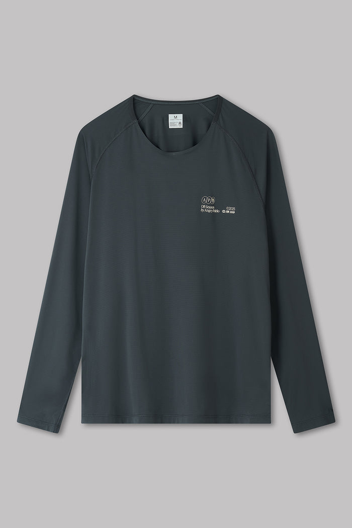 Black long-sleeve shirt with a logo on a gray background