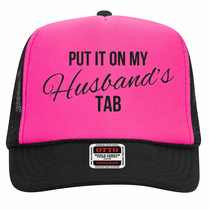 Tea Shirt Shoppe Wholesale neon pink foam trucker hat with black mesh back and Put It On My Husbands Tab graphic.