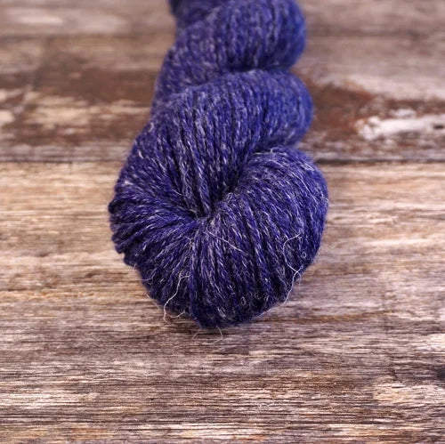 Blue skein of yarn on a wooden surface 9813_Figment Nua Sport