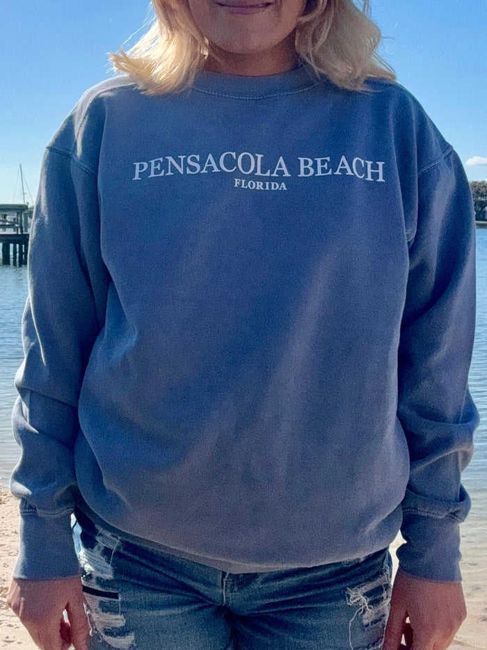 Pensacola Beach Icon Sweatshirt in worn blue shown on model in a size small front view
